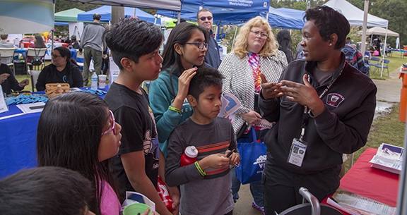 DEC staff talk to attendees at 2018 Imagine event