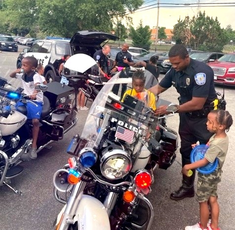 motorcycle officer and kids