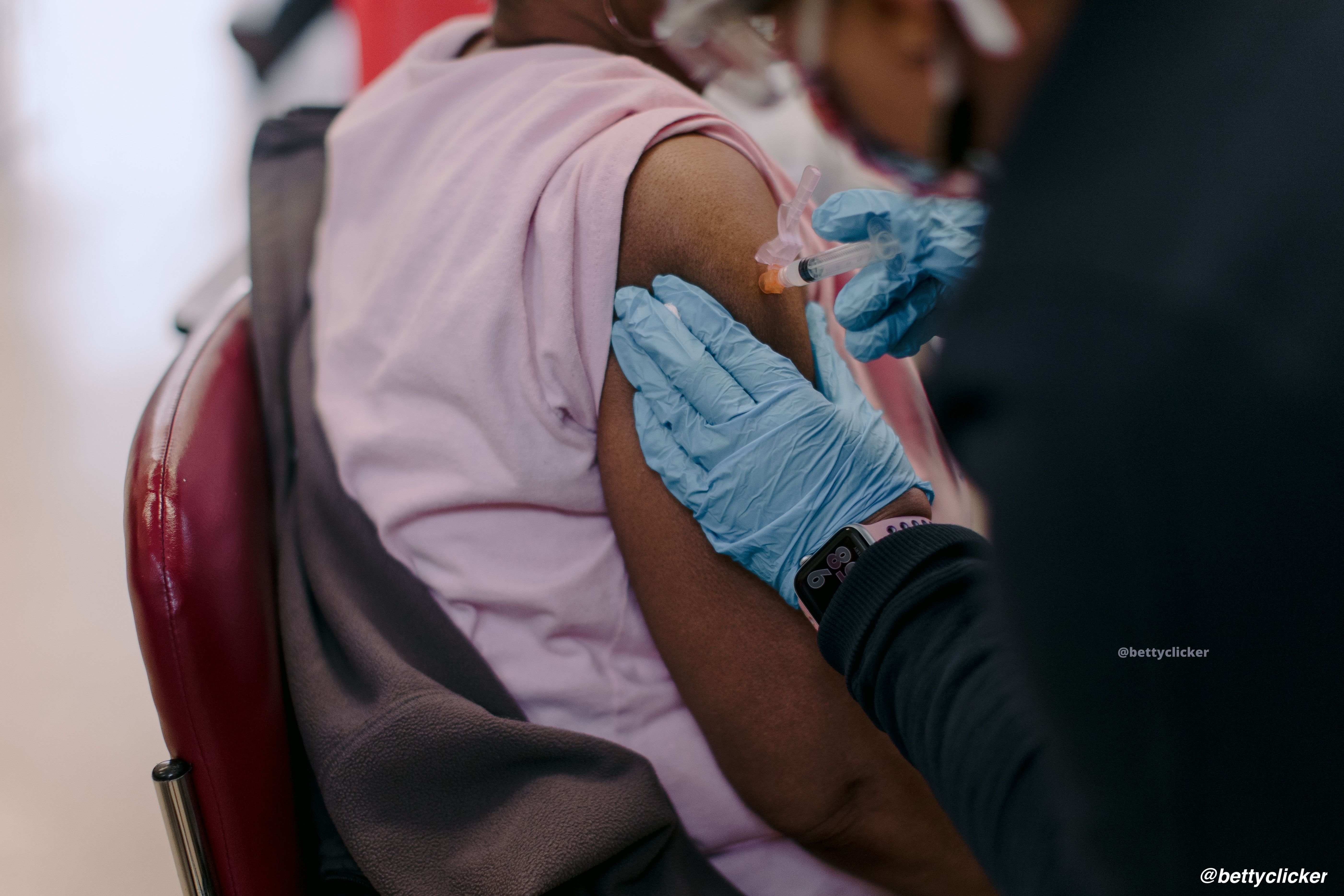 Young woman getting vaccinated