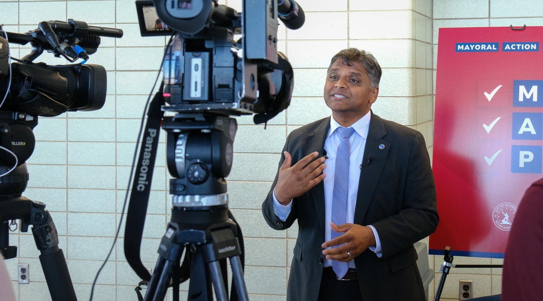 Mayor Danny Avula in front of news cameras