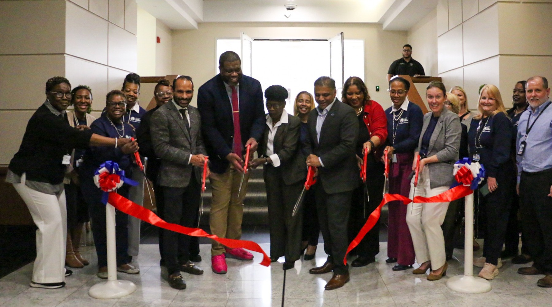 A group City employees cutting a ribbon
