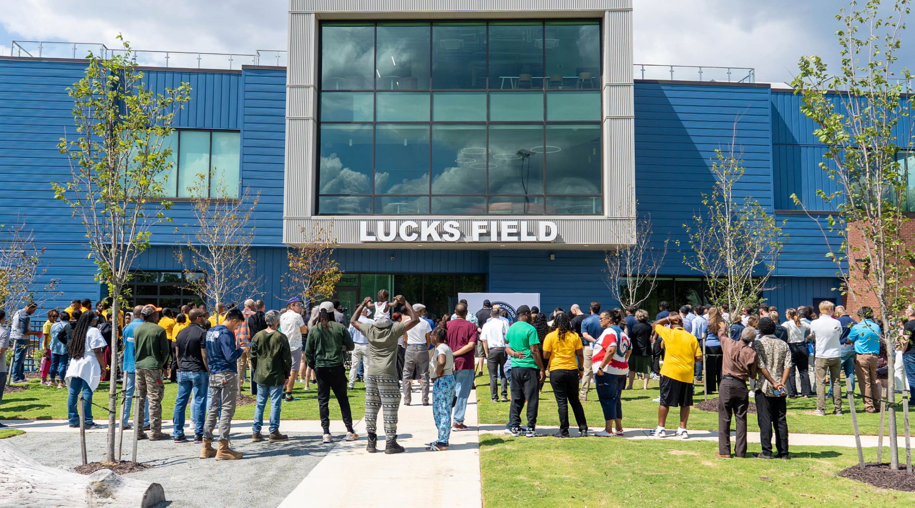 Community members in front of the Lucks Field Community Center
