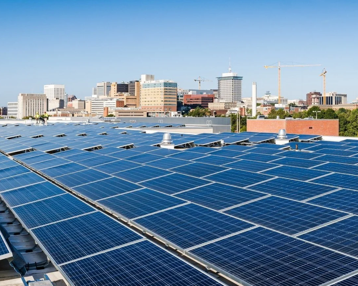 An image of the Richmond skyline with solar panels in the foreground