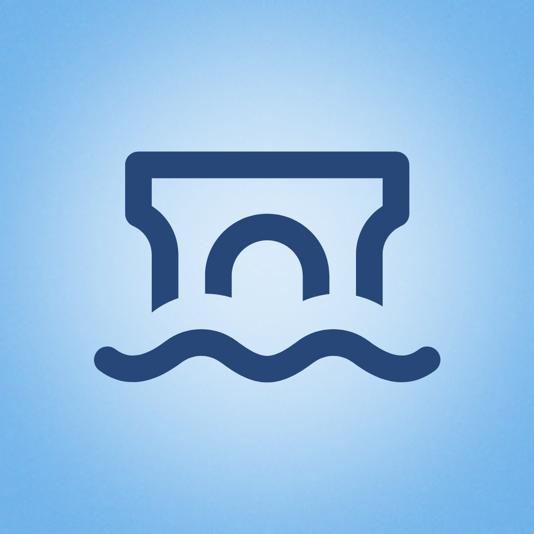 An image of a rapid with a bridge over top of it