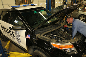 Fleet - Image - Mechanic working on a Police car