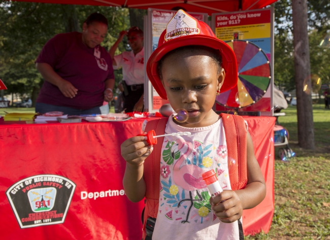 Child with bubbles at National Night Out 2019