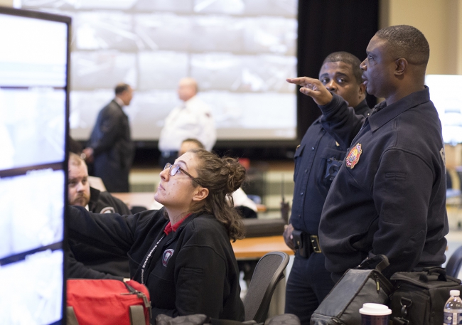 DEC staff work in the Emergency Operations Center