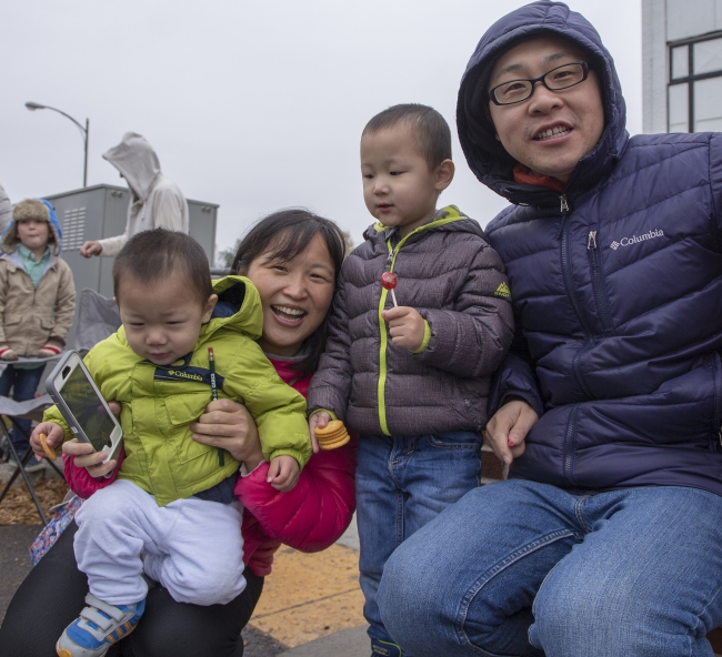 Family with 911 pencils at Christmas Parade