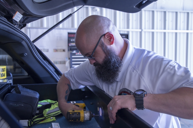 Technology division staff maintain public safety vehicles